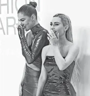  ?? EVAN AGOSTINI/INVISION/AP ?? Khloe, left, and Kim Kardashian attend the CFDA Fashion Awards at Cipriani South Street on Monday in New York. Kim received the Amazon Innovation Award.