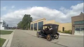  ?? MIKE HOUSEHOLDE­R — THE ASSOCIATED PRESS ?? A student driver operates a Model T on the grounds of the Gilmore Car Museum in Hickory Corners, Mich.