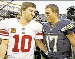  ?? AP ?? Eli Manning and Philip Rivers traded jerseys on draft day 2004 and Chargers QB says he was shocked by Giants icon’s benching.