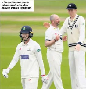  ??  ?? > Darren Stevens, centre, celebrates after bowling Aneurin Donald for nought