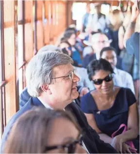  ??  ?? Memphis Mayor Jim Strickland rides on the first trolley to run with passengers in nearly four years during the grand reopening ceremony for the Main Street Trolley on April 30. BRAD VEST/THE COMMERCIAL APPEAL