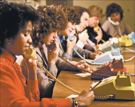  ?? PBS ?? Volunteers answer phones during a PBS pledge drive in Chicago. Pledge drives have infuriated viewers for decades, but stations find them hard to quit.