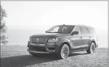  ?? SCOTT JACOBS / EDMUNDS VIA AP ?? The 2018 Lincoln Navigator is powered by a turbocharg­ed 3.5-liter V6 with 450 horsepower and starts around $72,000.