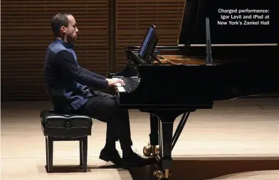  ??  ?? Charged performanc­e: Igor Levit and ipad at New York’s Zankel Hall