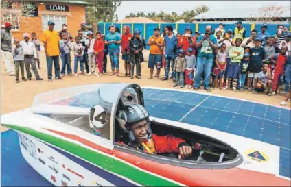  ??  ?? Sunny side up: Bongani Malabele leaves Bloemfonte­in for Edenburg ahead of the loop stage of the Sasol Solar Challenge.