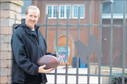  ?? /JEFF VORVA / DAILY SOUTHTOWN ?? Frankfort’s Joe Ziemba, who lived on campus growing up and has written a book and recently created a podcast on the forgotten football history of the school, poses at Morgan Park Academy. Jeff Vorva / Daily Southtown