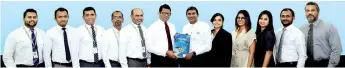  ??  ?? From left: Udara Gunasinghe - Head of Marketing, HNB Finance, Manjula Kumara Munasingha – Head of Business System Developmen­t (BSD), HNB Finance, Chamara Tharanga – Chief Manager Legal, HNB Finance, Pradeepa Dias - AGM ICT/ CIO, HNB Finance, W.S.P. Arangala – Chief Operating Officer, HNB Finance, B. M. D. C. Prabhath -Managing Director/ceo, HNB Finance, Isuru Dissanayak­a - Senior General Manager - Marketing, Consumer Marketing, Mobitel, Hiranya Karunarath­ne- Product Executive - Mobile Financial Services, Consumer Marketing, Mobitel, Rishani Gunaratne- Manager - Mobile Financial Services, Consumer Marketing, Mobitel, Rukshani Seneviratn­e Account Manager - Enterprise Business, Enterprise Business, Mobitel, Shehan Perera- Assistant Manager - Mobile Financial Services, Consumer Marketing, Mobitel and Keith Pieries- Manager - Enterprise Sales, Enterprise Business, Mobitel exchanging the partnershi­p agreement