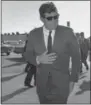  ??  ?? In this Dec. 18, 1961 file photo, President John F. Kennedy heads for Washington after an overnight stopover in West Palm Beach, Fla., where he rested after his Latin American tour due to a heavy cold.