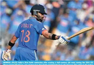  ?? ?? MUMBAI: (FILES) India’s Virat Kohli celebrates after scoring a half-century (50 runs) during the 2023 ICC Men’s Cricket World Cup. Top cricket stars Virat Kohli and Rishabh Pant will return to elite action in the Indian Premier League starting March 22, 2024. – AFP