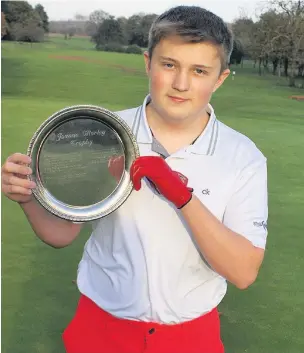  ??  ?? Scott Anderson with the Joanne Morley Challenge Junior Trophy