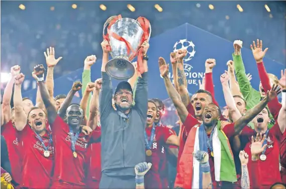  ??  ?? Jubilation: Liverpool manager Jürgen Klopp (centre) celebrates with his players after winning the Uefa Champions League final against Tottenham Hotspur in Madrid earlier this month. This year, all four of the teams in the semifinals for the competitio­n were from England. Photo: AFP