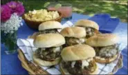  ?? SARA MOULTON VIA AP ?? This photo shows beer-steamed chili cheeseburg­ers in Ashby, Mass. This dish is from a recipe by Sara Moulton.