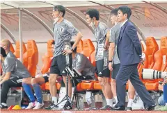  ?? AFP ?? Japan coach Hajime Moriyasu, right, watches the match against Saudi Arabia on Thursday in Jeddah. Japan lost 1-0.