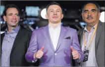  ??  ?? WBA and WBC middleweig­ht champion Gennady Golovkin with trainer Abel Sanchez, right, and promoter Tom Loeffler at Microsoft Square in Los Angeles on Feb. 27.