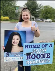  ??  ?? Daniel Boone senior Katrina Robbins, 18, Birdsboro, with her Senior Portrait yard sign that was gifted by the Blazer Education Foundation.