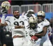  ?? JOHN BAZEMORE — THE ASSOCIATED PRESS ?? Johnson, who said he was almost fully recovered from a late-season shoulder injury, ran for 71 yards.
UCF led 13-6 at halftime despite being held under 14 points at the break for the first time this season.