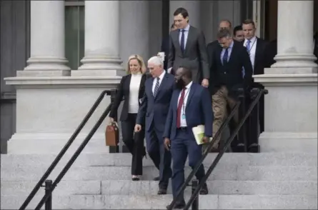  ?? ALEX BRANDON — THE ASSOCIATED PRESS ?? Homeland Security Secretary Kirstjen Nielsen, Vice President Mike Pence, White House legislativ­e affairs aide Ja’Ron Smith, followed by White House senior adviser Jared Kushner and others, walk down the steps of the Eisenhower Executive Office building, on the White House complex, after a meeting with staff members of House and Senate leadership on Saturday.