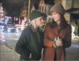  ?? Jojo Whilden Hulu ?? KRISTEN STEWART plays Abby, a student pursuing a doctorate in history, left, and Mackenzie Davis plays Harper, a journalist, in Hulu’s new “Happiest Season.”