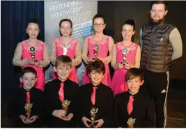  ??  ?? The Boherbue Set Dancers, with Kevin Roche, Kanturk Credit Union after their victory in the Duhallow Scór na Páistí Final in the Edel Quinn Hall, Kanturk. Picture John Tarrant