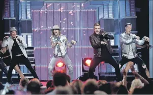  ?? AP PHOTO ?? Brian Littrell, left, and Nick Carter, second from right, of Backstreet Boys, and Brian Kelley, second left, and Tyler Hubbard, right, of Florida Georgia Line, perform at the 52nd annual Academy of Country Music Awards at the T-Mobile Arena on Sunday...