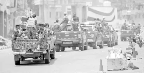  ??  ?? Yemeni police patrol the streets of the southern city of Taez. — AFP photo