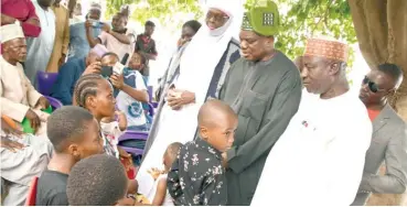  ?? ?? Permanent Secretary, FCTA, Mr Olusade Adesola flanked by the Sarkin Jiwa HRH Idris Musa and the Secretary, Area Council Secretaria­t, Ibrahim Abubakar Dantsoho comforting the family members of one of the victims of the Dei-dei clash