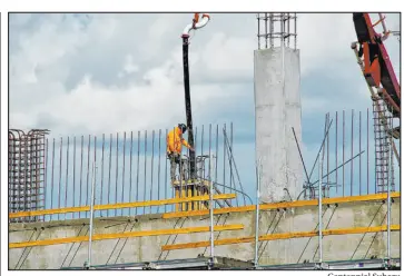  ?? Centennial Subaru ?? A constructi­on worker pours a second-floor column at Centennial Subaru, Southern Nevada’s newest automotive dealership that is set to open in November.