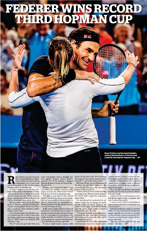  ??  ?? Roger Federer and his mixed doubles partner Belinda Bencic of Switzerlan­d celebrate winning the Hopman Cup. —