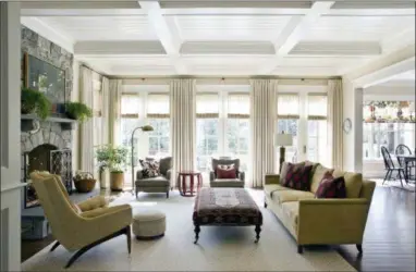  ?? ANGIE SECKINGER — MARIKA MEYER INTERIORS VIA AP ?? This photo provided by Marika Meyer Interiors shows a living room in McLean, Va. As 2019 approaches, Washington D.C.based interior designer Marika Meyer sees a trend toward warm neutral colors and antique furniture in warm wood tones, as seen in this living room designed by Meyer.