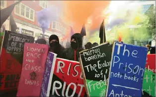  ?? Picture: AP/African News Agency (ANA) ?? FEE ANGER: Students display banners outside the Department for Business, Innovation and Skills during a protest calling for the abolition of tuition fees and an end to student debt, in Westminste­r, London.