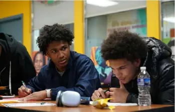  ?? ?? Dorothy Roach, 14, center, talks with her group during a character developmen­t and affirmatio­n exercise at a peer mentoring session. High school seniors this year were among the first group of college applicants to traverse a changed admissions process after the U.S. Supreme Court overruled race-based admissions last year.