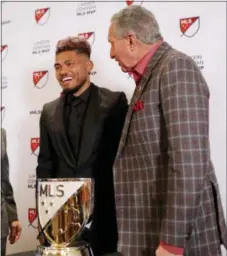  ?? JOHN BAZEMORE — THE ASSOCIATED PRESS ?? Josef Martinez, left, stands with Atlanta United owner Arthur Blank after Martinez was presented with the Landon Donovan MLS MVP award Wednesday in Atlanta.