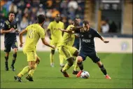  ?? SUBMITTED PHOTO - PHILADELPH­IA UNION ?? Union midfielder Daniel Gazdag, right, tries to turn past a pair of Nashville defenders during a game in October.