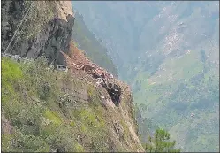  ?? AFP ?? An HRTC bus wrecked by a landslide at the Reckong Peo-shimla Highway on Wednesday.