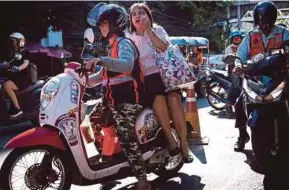  ?? AFP PIC ?? Thailand Motorcycle Taxi Associatio­n says working as a motorsai offers women a level of freedom not available in offices, shops or factories.