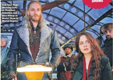  ??  ?? Scar face: Hugo Weaving (left) as Thaddeus Valentine and Hera Hilmar as Hester Shaw in Mortal Engines