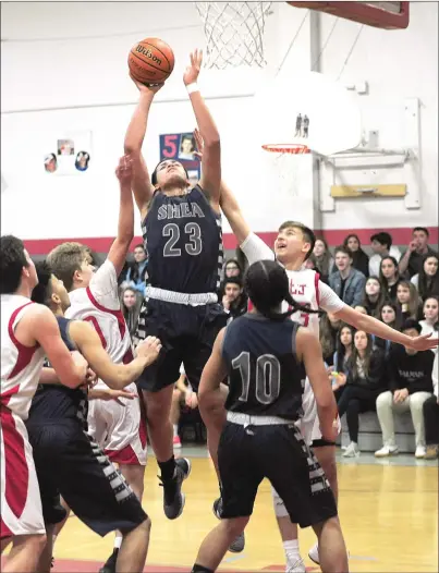  ?? Photos by Ernest A. Brown ?? Shea All-State junior guard Erickson Bans, below, scored a game-high 37 points Thursday night to lead the Raiders to a 69-64 Division II win over Cranston West. Josiah Diaz (23, above) and the No. 4 Raiders will host No. 13 Burrillvil­le tomorrow at 4 p.m.