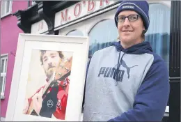  ?? (Pic: John Ahern) ?? REMEMBERIN­G THOMAS: Peter O’Donoghue, Macroney, Kilworth, displaying the specially commission­ed painting of his late brother, Thomas, by local artist, Pawel Wroblewski.