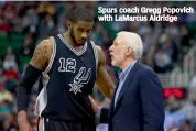  ?? — AFP ?? Spurs coach Gregg Popovich with LaMarcus Aldridge