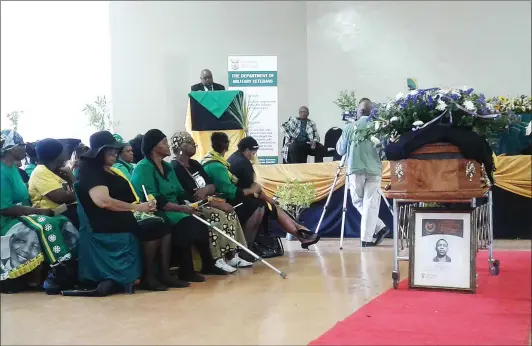  ?? Picture: DOMINIC ADRIAANSE ?? TRIBUTE: Sports Minister Thulas Nxesi pays his respects to anti-apartheid activist Michael Lucas, during a service in a packed Bongalethu Communal Hall in his hometown of Oudtshoorn. The former state prisoner’s remains have finally been returned to his...