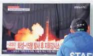  ?? AHN YOUNG-JOON/ASSOCIATED PRESS ?? A man watches a TV screen showing what the North Korean government calls the Hwasong-15 interconti­nental ballistic missile, at the Seoul Railway Station in Seoul, South Korea, in November.