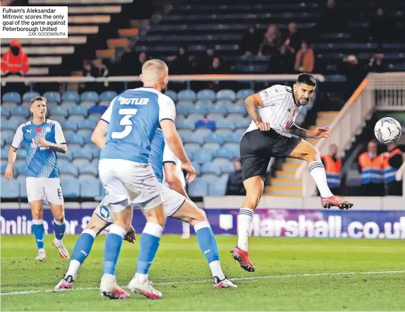  ?? ZAK GOODWIN/PA ?? Fulham’s Aleksandar Mitrovic scores the only goal of the game against Peterborou­gh United