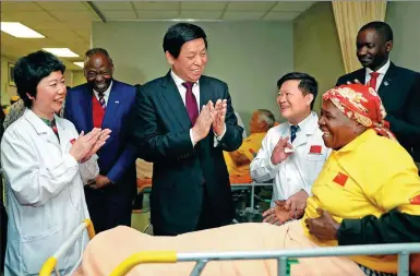  ?? LIU WEIBING / XINHUA ?? Top legislator Li Zhanshu visits patients on Wednesday who have undergone cataract surgery in Windhoek, Namibia, as part of the Brightness Journey campaigns, through which China has helped bring clear vision to many around Africa.