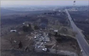  ?? PHOTOS BY JULIO CORTEZ — THE ASSOCIATED PRESS ?? This property in Canadian, Texas, was burned by the Smokehouse Creek fire Wednesday.