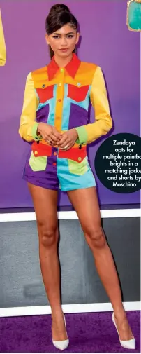  ??  ?? Zendaya opts for multiple paintbox brights in a matching jacket and shorts by Moschino