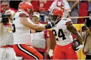  ?? ASSOCIATED PRESS ?? Browns guard Joel Bitonio (left), about to appear in and start his 100th game, could get a game ball every week, offensive coordinato­r Alex Van Pelt says.