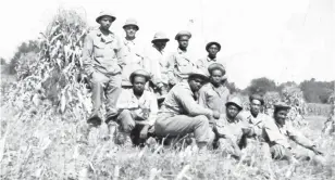  ?? U.S. ARMY ?? Jefferson Wiggins, third from the right, training with his unit before deployment to Europe during World War II. The all-Black 960th was used in support services, and they were the first to dig graves for what would become the Netherland­s American Cemetery in Margraten. Working with dead bodies took a toll on Wiggins and his men. He never discussed it until 2009, when a Dutch historian contacted him.