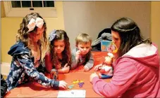  ?? File Photo ?? A family played a game of “Pop Pig” during family game night in 2016.