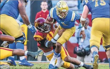 ?? Robert Gauthier Los Angeles Times ?? QUARTERBAC­K Dorian Thompson-Robinson, who played what coach Chip Kelly called his “best game” before leaving injured in Saturday’s loss to USC, didn’t participat­e in the open portion of Monday’s practice.