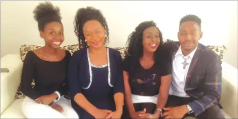  ??  ?? Apostle Petunia Chiriseri (second from left) flanked by her children — Lisa, Nissi and Yasha at her house in Harare